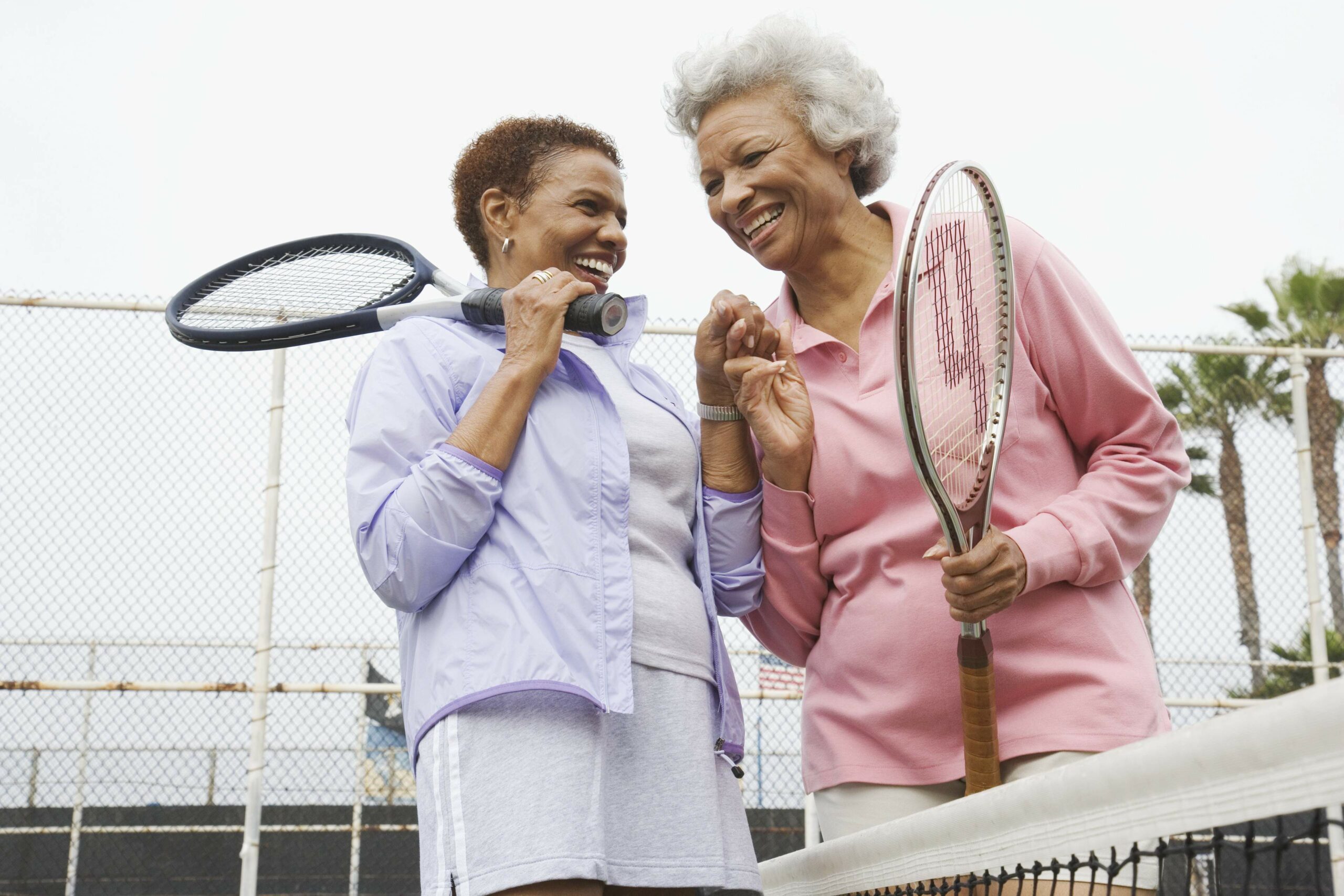 Elderly women hanging out and playing tennis UofL Health