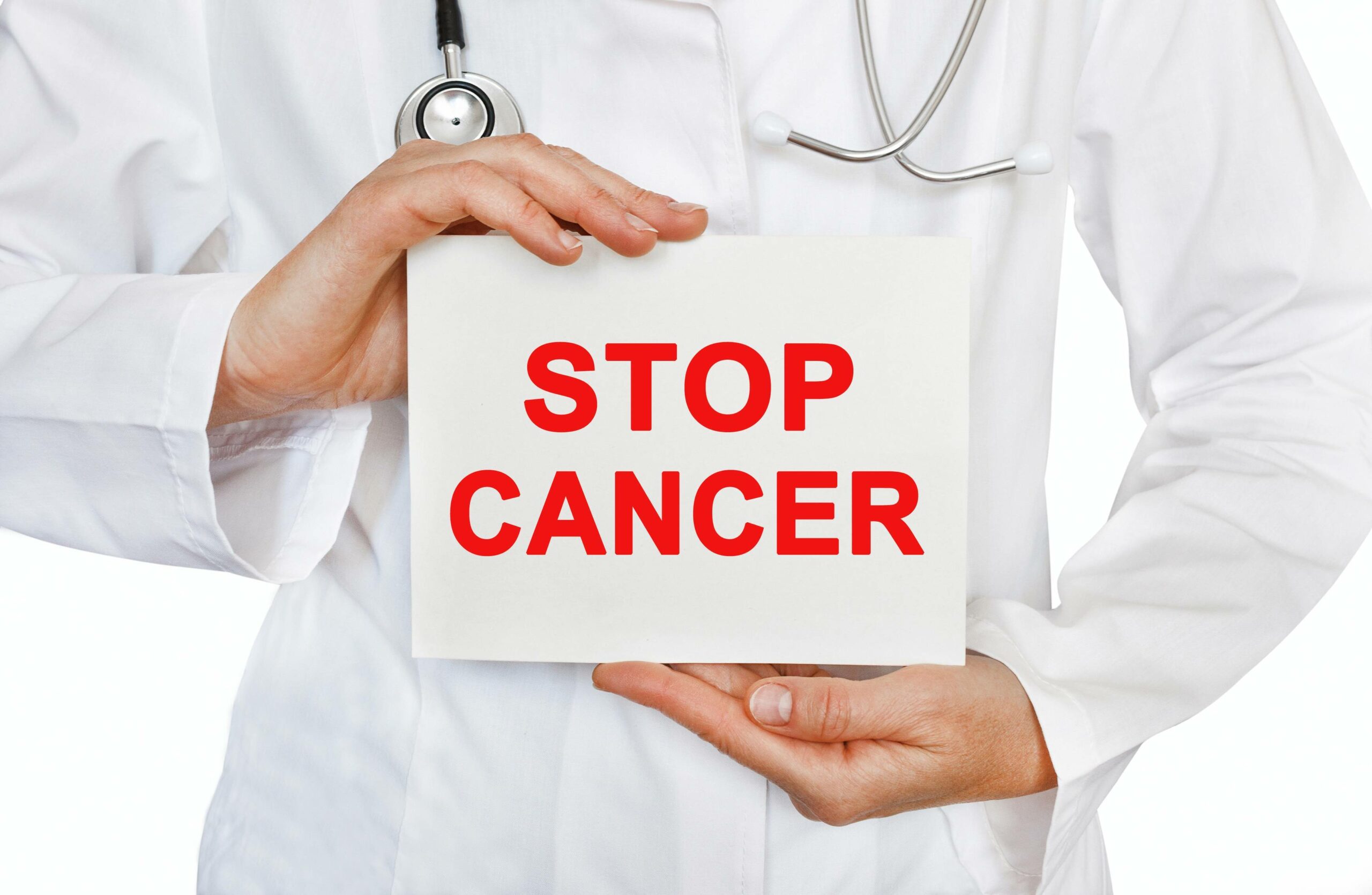 Doctor holding a card with Stop Cancer, Medical concept