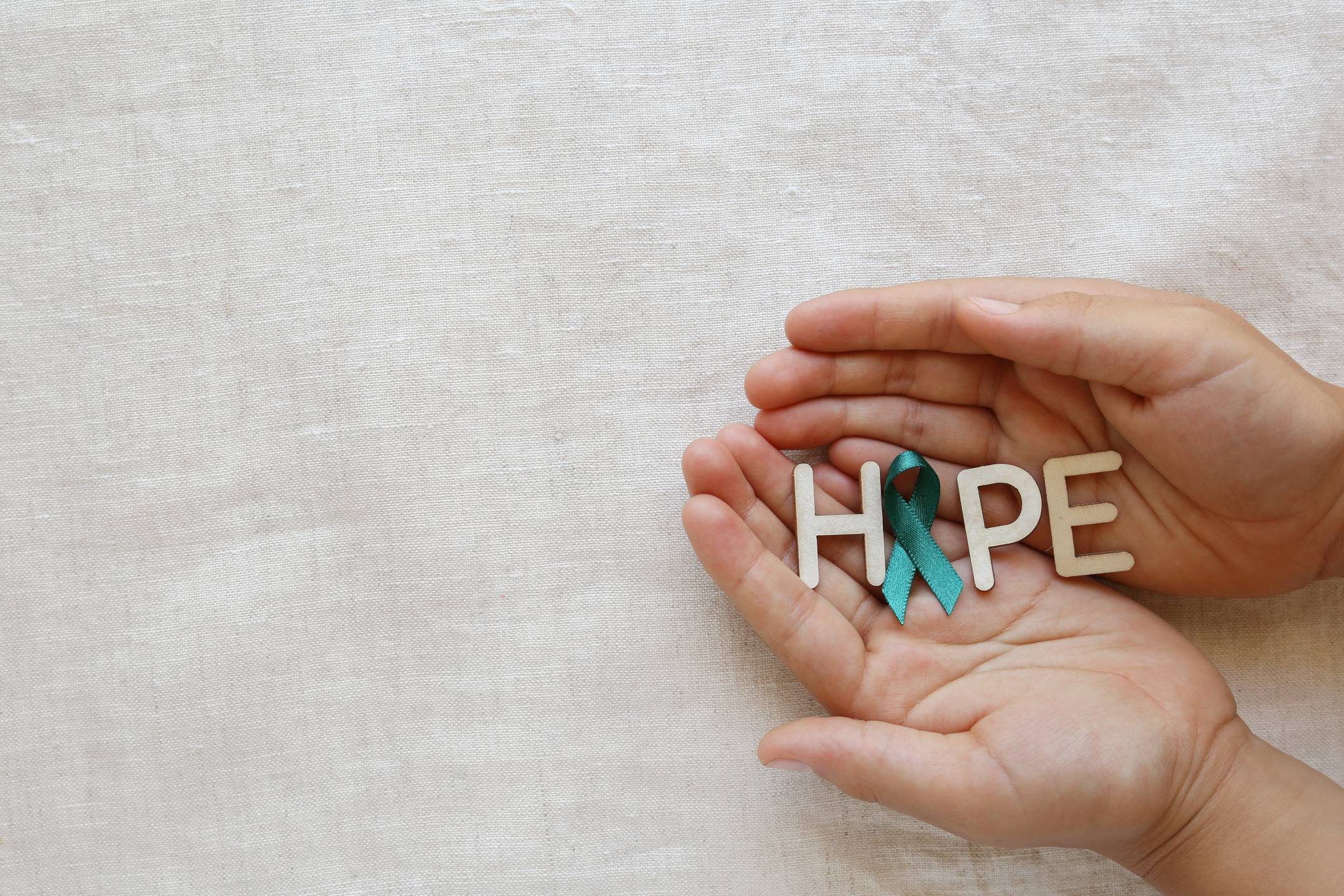 HOPE with Teal Ribbon on hands, Ovarian Cancer, cervical Cancer,