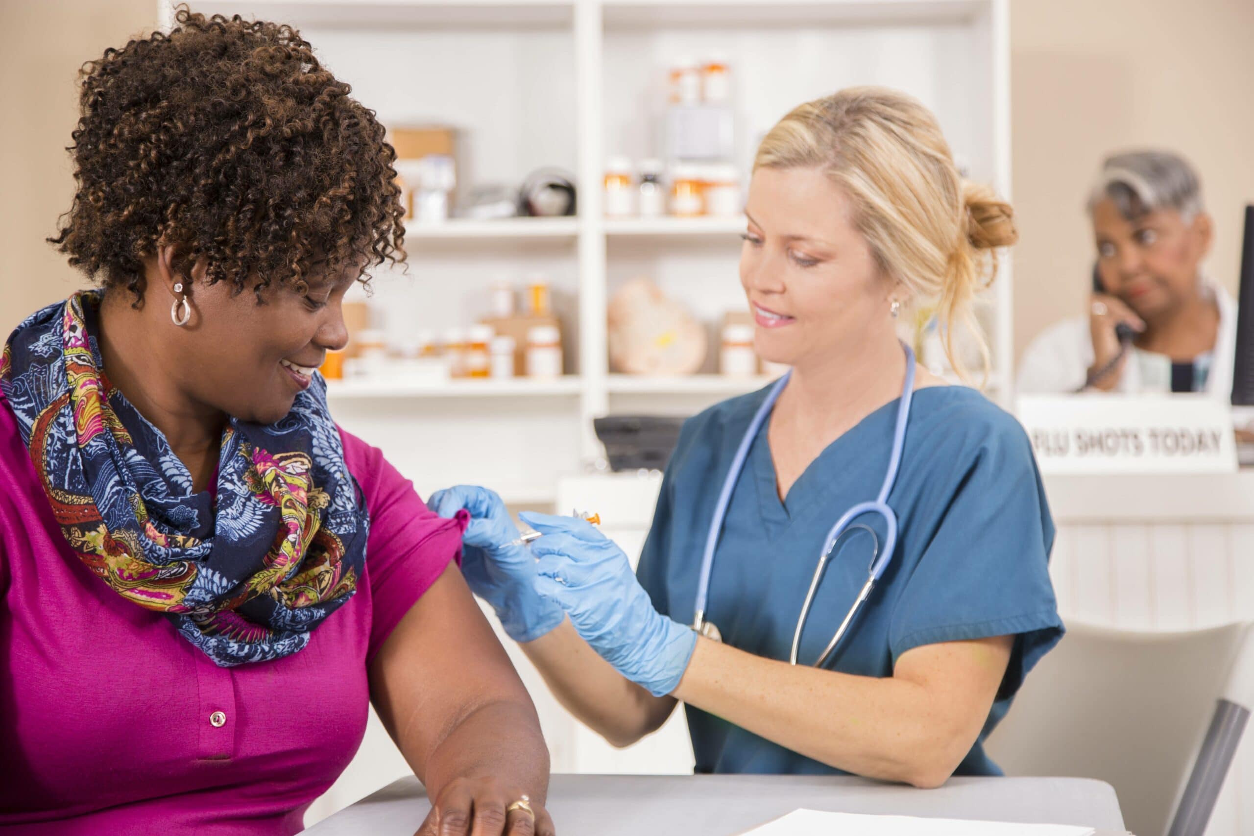 woman getting a flu shot by provider Louisville Ky