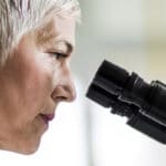 pathology doctor looking into microscope louisville ky
