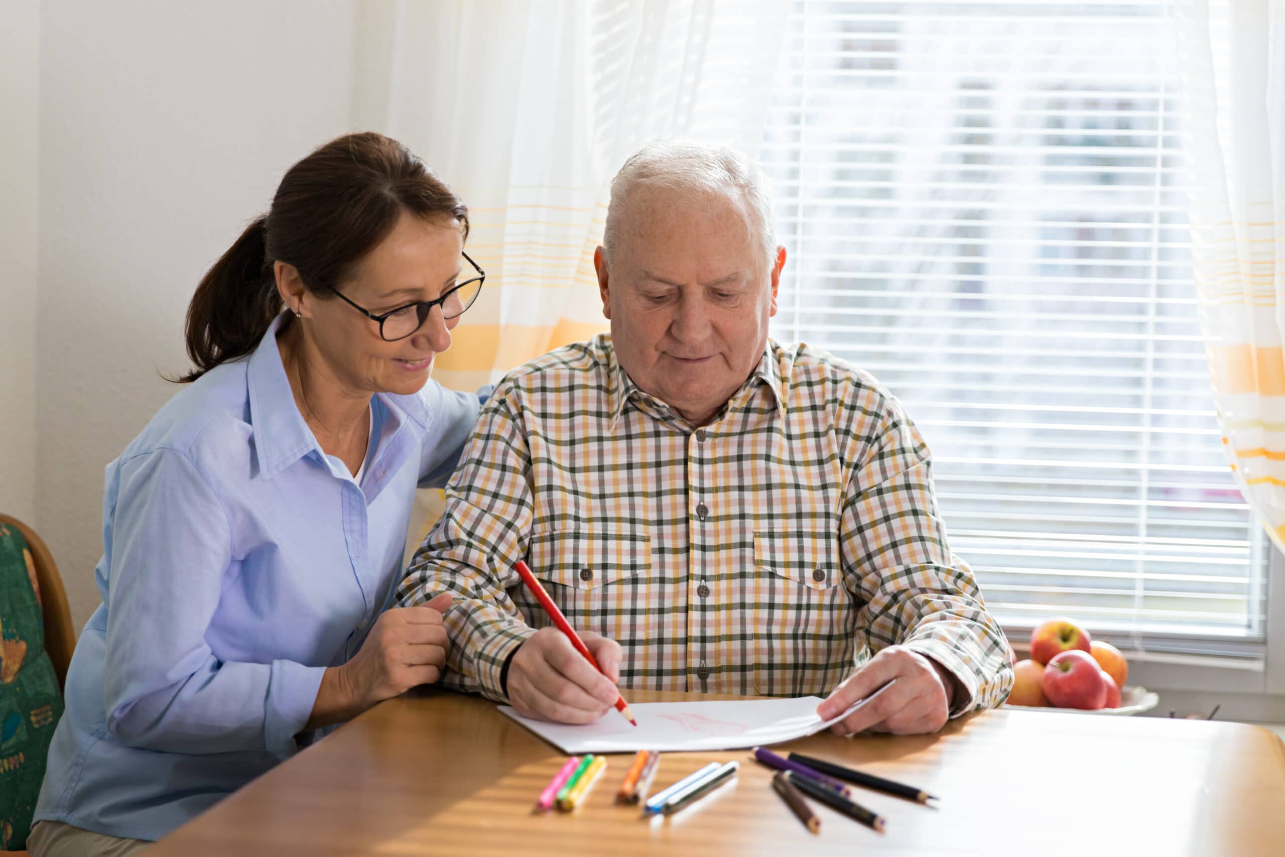 Dementia and Occupational Therapy - Home caregiver and senior adult man