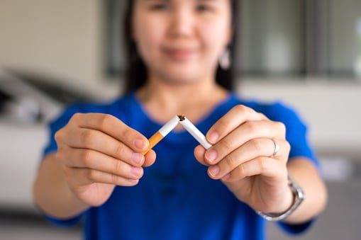 Woman breaking a cigarette apart UofL Health gives tips to help you stop smoking