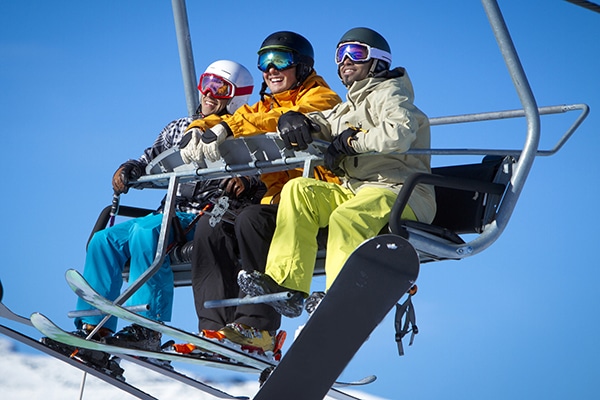 A group of friend on a ski lift