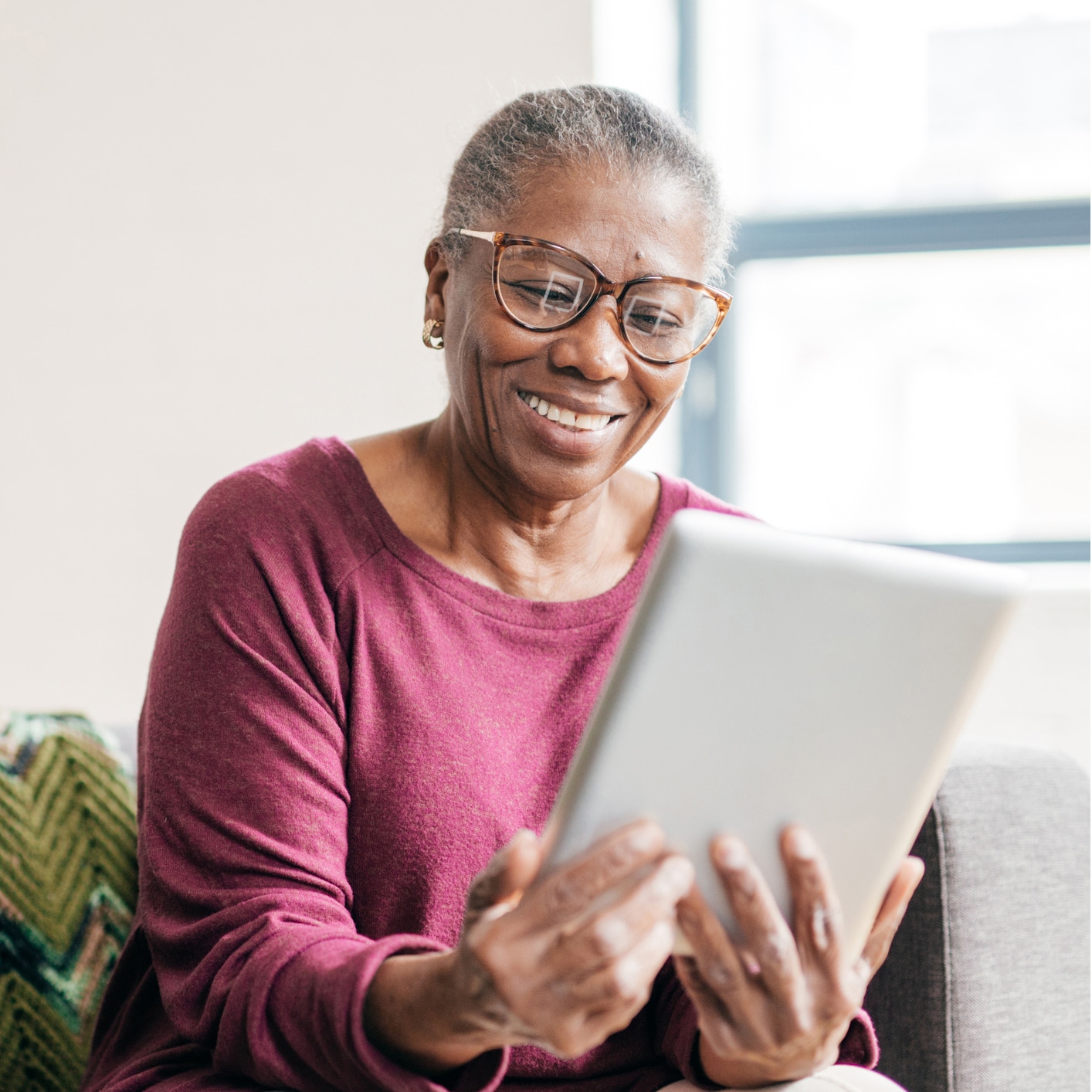 Senior women using tablet for smart home application