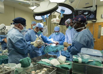 Heart surgeons at Jewish Hospital transplanting artificial heart