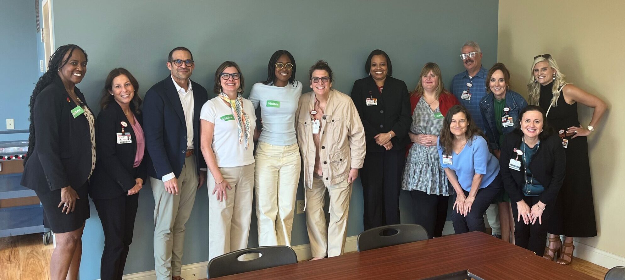 Peace Hospital Scholarship for Inclusive Excellence for Mental Health Professionals recipient Jade Finley poses with members of the Peace Hospital staff.